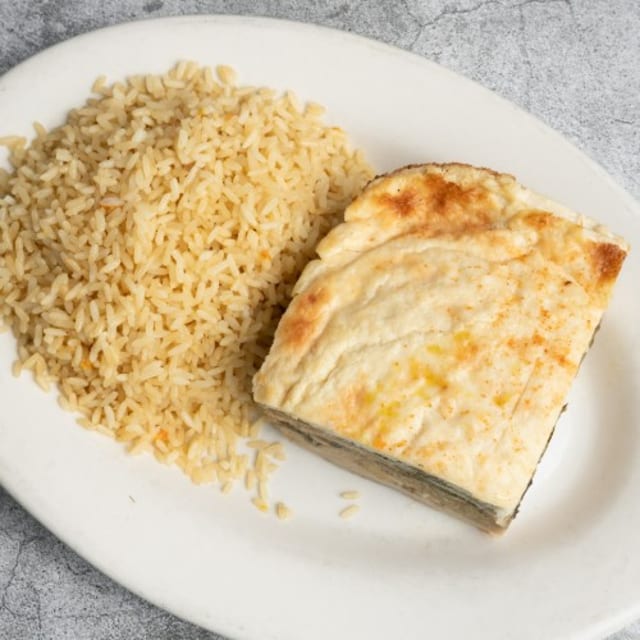 Vegetarian Mousaka Served with Rice Pilaf.